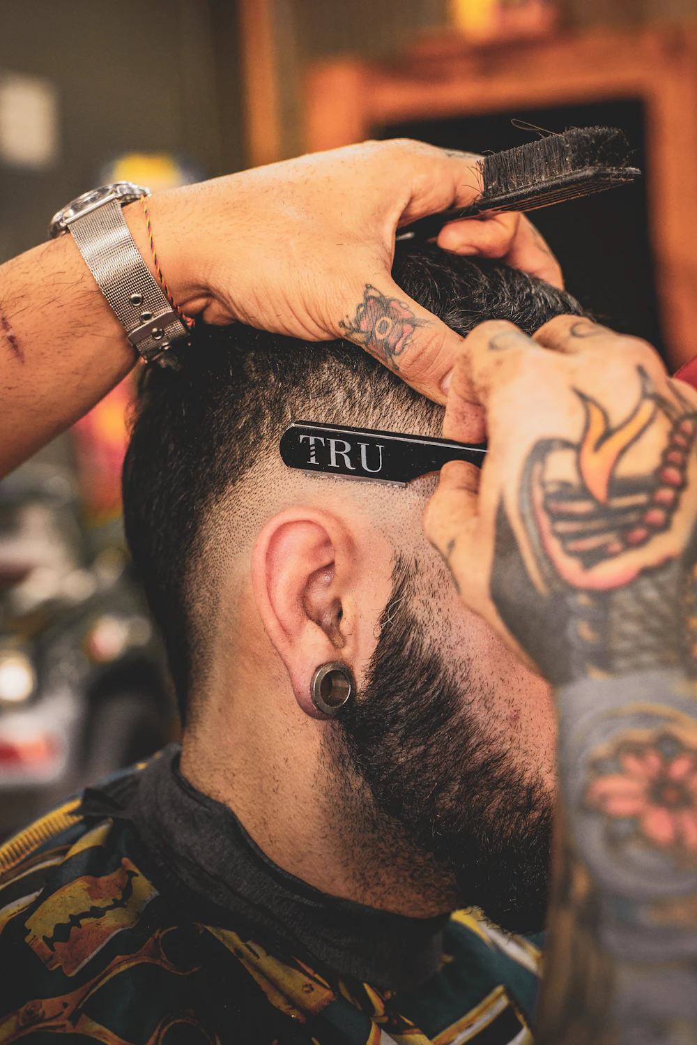 Close-up of a short, blended haircut being finished; stock inspiration, not Alpha Cuts work